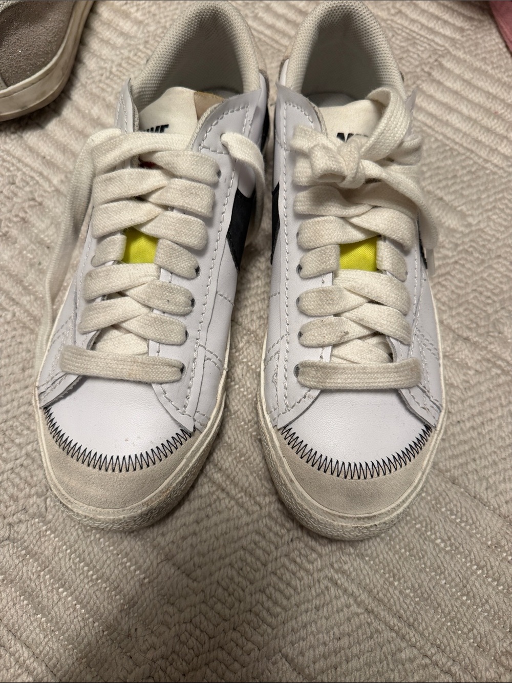 Nike White Sneakers with Black Swoosh and Yellow Tongue